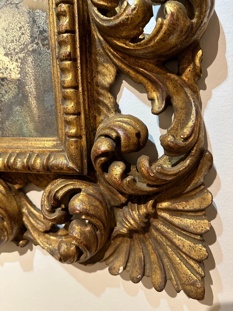 Antique Italian Carved Giltwood Frame and Antiqued Glass Wall Mirror