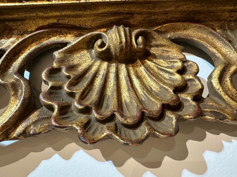 Antique Italian Carved Giltwood Frame and Antiqued Glass Wall Mirror