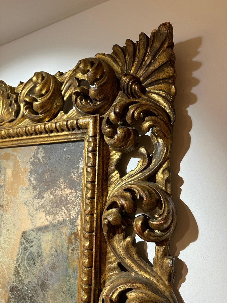 Antique Italian Carved Giltwood Frame and Antiqued Glass Wall Mirror